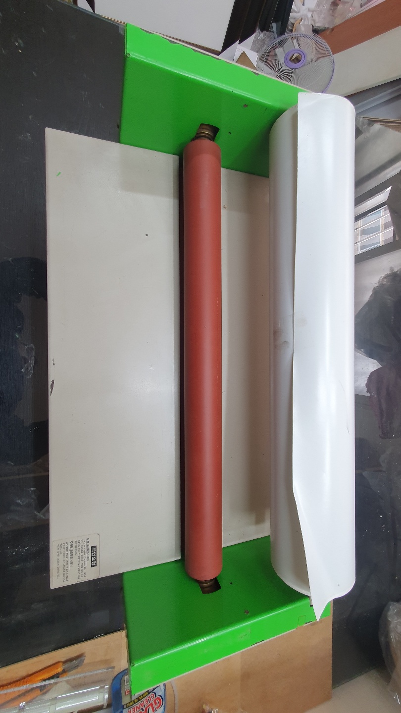 사진 롤 코팅기