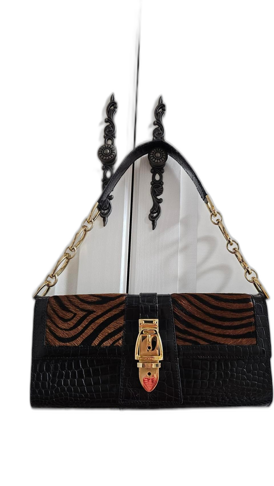 모조에스핀 송치가죽 클러치백