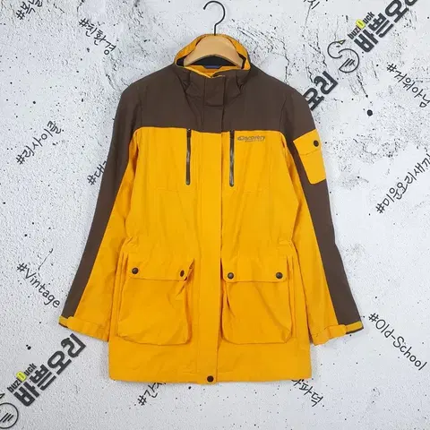디스커버리 DISCOVERY 바람막이 자켓 옐로우 3800039