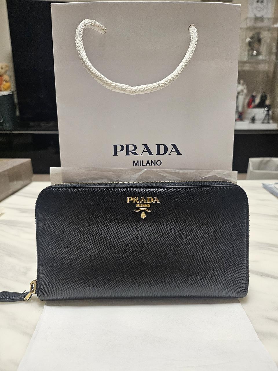 프라다 사피아노 가죽 장지갑 구찌 디올 루이비통 셀린느 집어라운드 버버리