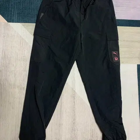 푸마 강다니엘 우븐 팬츠