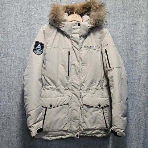 디스커버리 익스페디션 여성 마운틴쿡 구스다운 너구리털 패딩 100